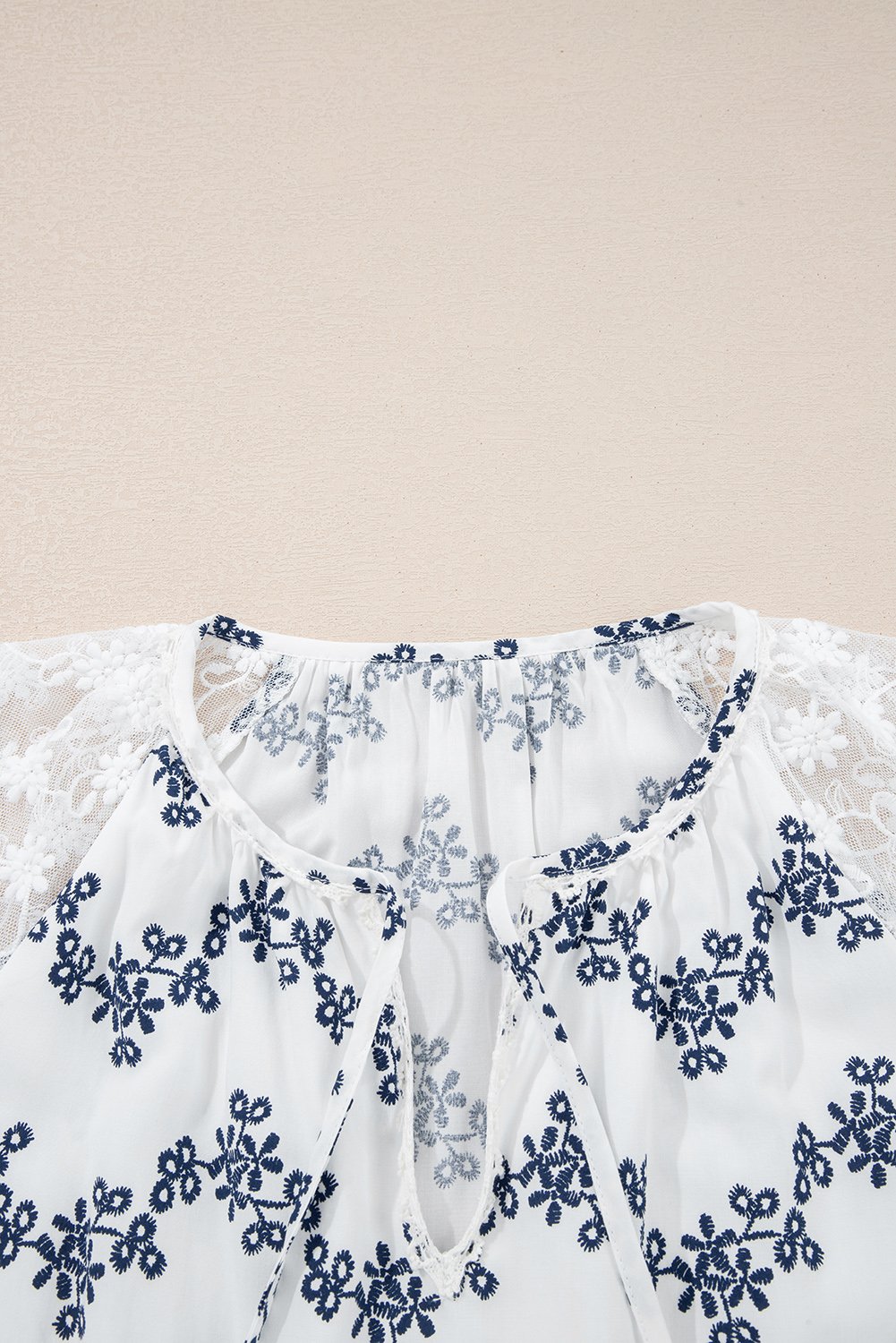 97027081-3e3b367476680379.jpg blue lace patchwork floral bubble sleeve v split neck blouse