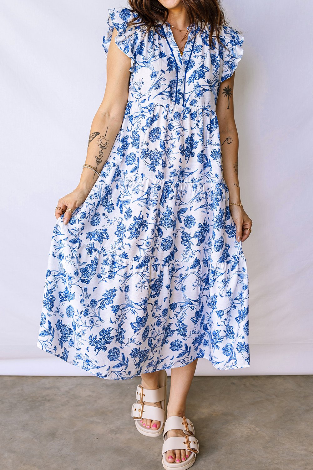 97026983-604610c5609fed7c.jpg blue ruffled short sleeve tiered floral midi dress